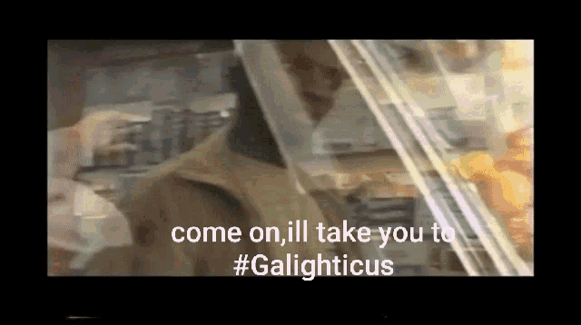 a man standing in front of a glass door with the words come on ill take you to #galighticus