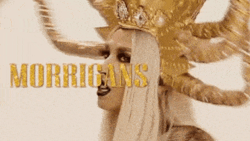 a woman wearing a gold costume with horns and the word morrigans written in gold .