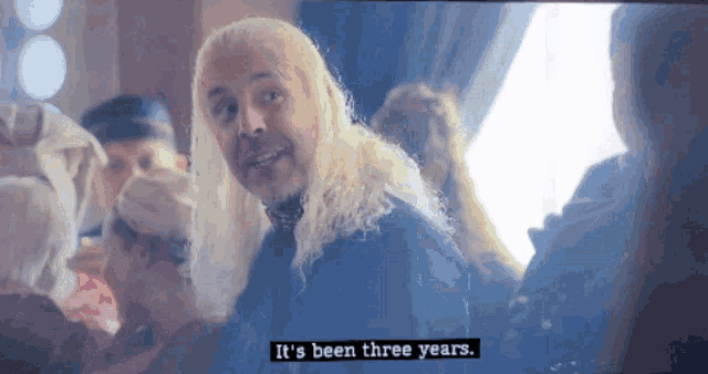 a man with blonde hair says it 's been three years in a screen shot