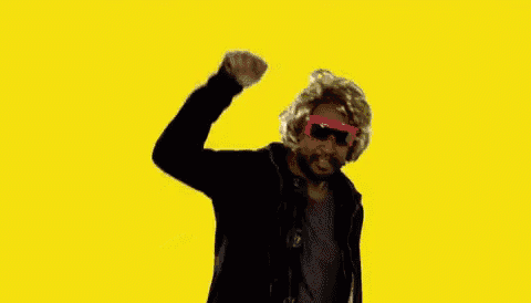 a man wearing a wig and sunglasses says party hard