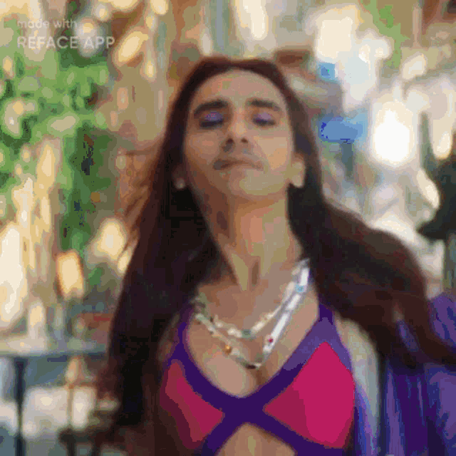 a blurred image of a woman with the word reface app visible