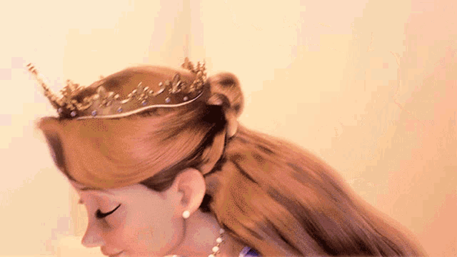 a close up of a woman wearing a tiara and earrings
