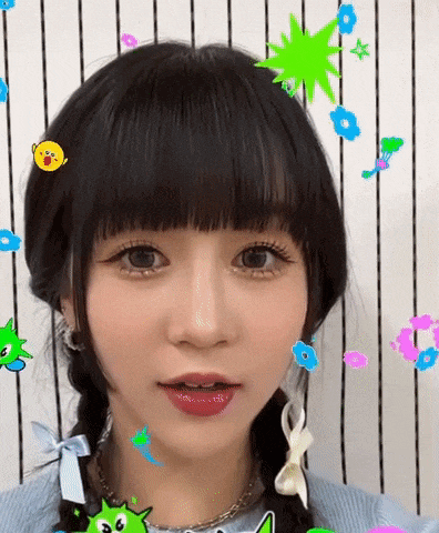 a girl with pigtails and stickers on her hair