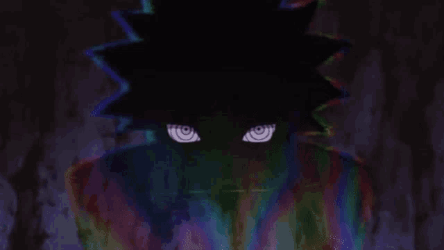 a close up of a person 's face with glowing eyes in the dark .