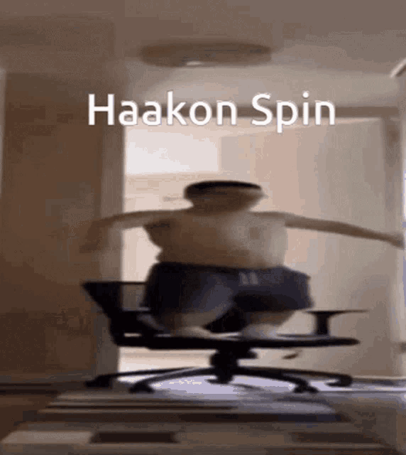 a man is jumping out of an office chair with the words haakon spin written above him .