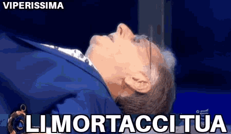 a man in a suit is laying down with the words viperissima on the top
