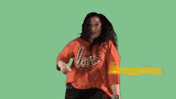 a woman in a red shirt with the name angeles camela on it