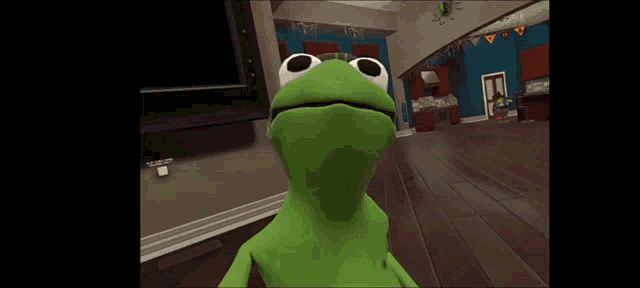 kermit the frog is standing on a wooden floor in a living room