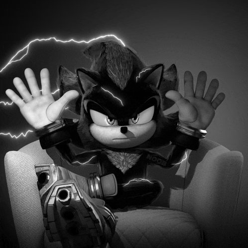 a black and white photo of a sonic the hedgehog sitting in a chair