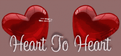 two red hearts with the words " heart to heart " written below them