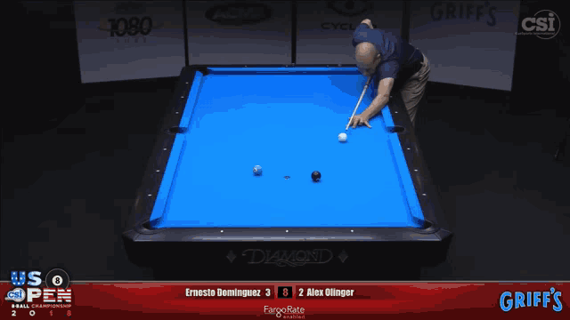 a pool table with a blue cloth that says griff 's on it
