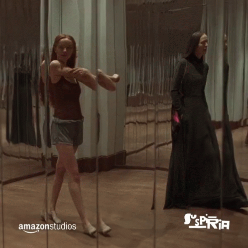 Walking In Front Of Mirror Stretching GIF - Walking In Front Of Mirror Stretching Checking Self Out GIFs