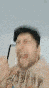 a man is taking a picture of himself with a cartoon character .