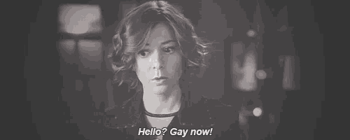 a black and white photo of a woman saying `` hello ? gay now '' .