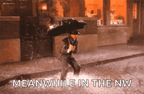 a man with an umbrella in the rain with the words meanwhile in the nw