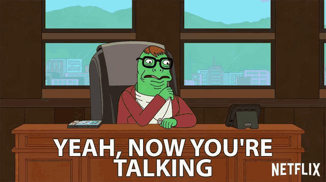 a cartoon of a man sitting at a desk with the words yeah now you 're talking