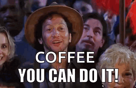 a man in a hat is sitting in a crowd of people and saying `` coffee you can do it ! ''