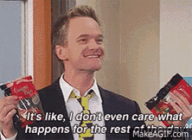 a man in a suit and tie is holding a bag of chips and saying it 's like