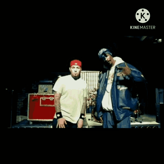 snoop dogg and eminem are standing next to each other in a video