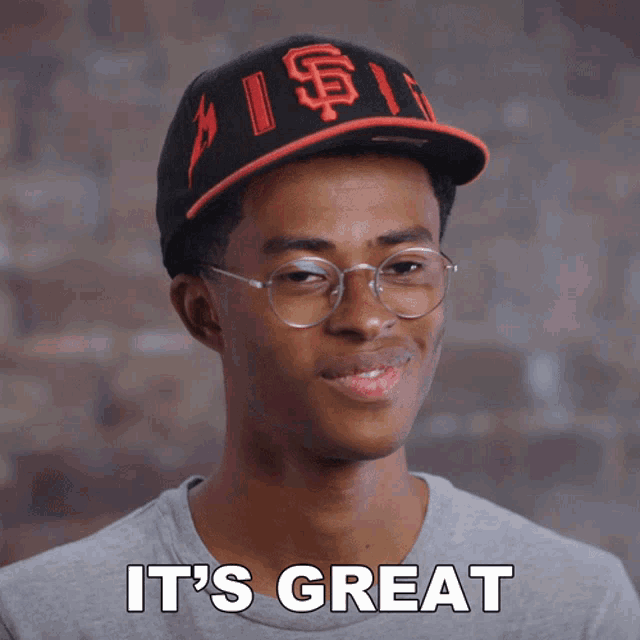 a young man wearing glasses and a hat says it 's great