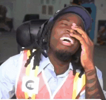 a man wearing a safety vest with the letter c on it laughs
