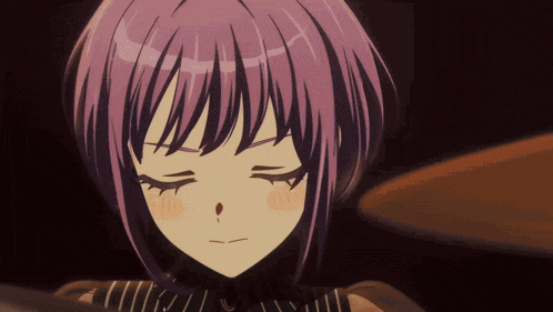 a girl with purple hair has her eyes closed and a red spot on her nose