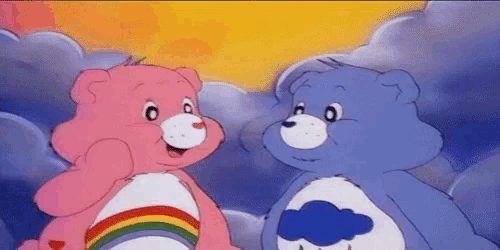 two care bears are standing next to each other