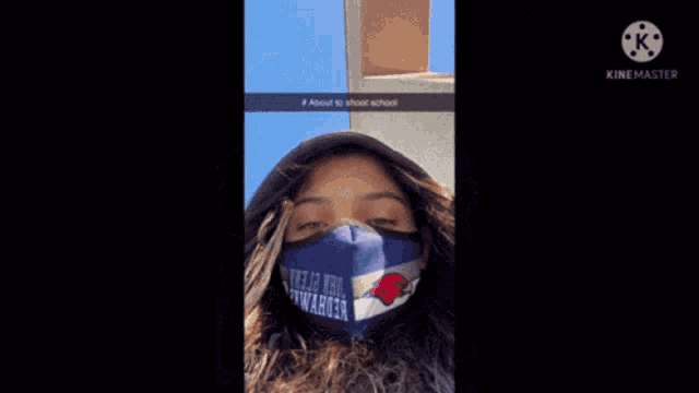 a woman wearing a blue face mask that says john o'neill on it