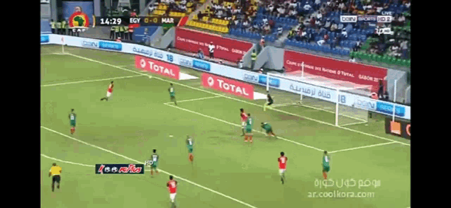 a soccer game is being played in a stadium with advertisements for total