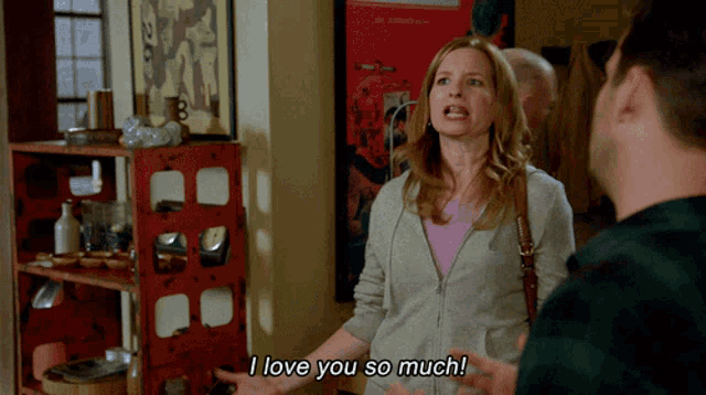 a woman says i love you so much while standing next to a man