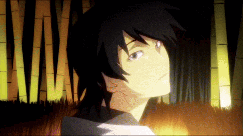 a man with black hair is standing in a dark forest