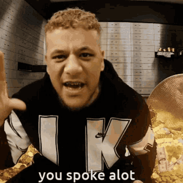 a man wearing a black nike sweatshirt says " you spoke alot "