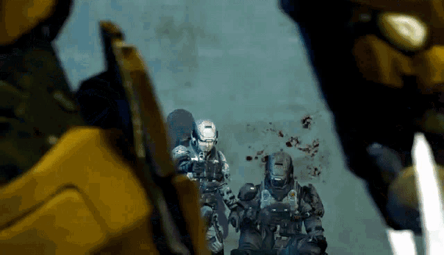 two soldiers are standing next to each other with blood coming out of their mouths