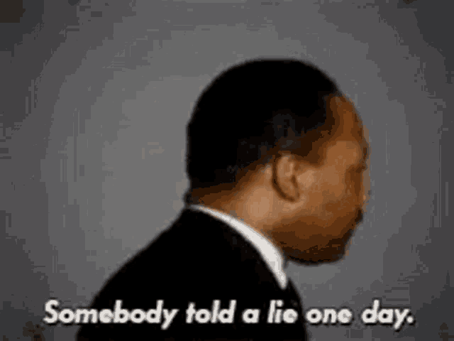 a man in a suit and tie is talking about somebody telling a lie one day .