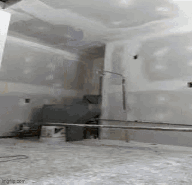 a boxing ring is being built in a room with a ceiling that is being built .