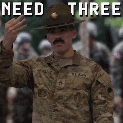 a soldier with the name arbuelles on his uniform waves