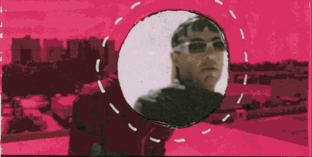 a man wearing sunglasses is surrounded by a circle on a pink background