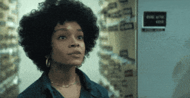 a woman stands in front of a file cabinet with the number 4319