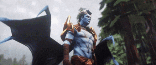 a video game character with blue and gold wings is standing in the woods .