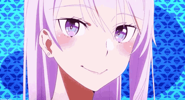 a close up of a girl 's face with purple eyes and white hair .