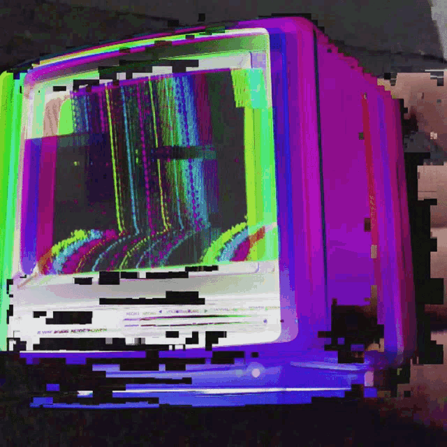 a computer monitor with a rainbow colored screen and a purple frame
