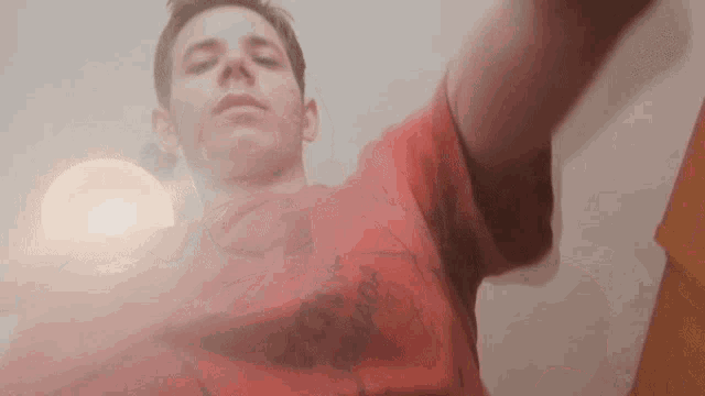 a man in a red t-shirt with the word canada on the front
