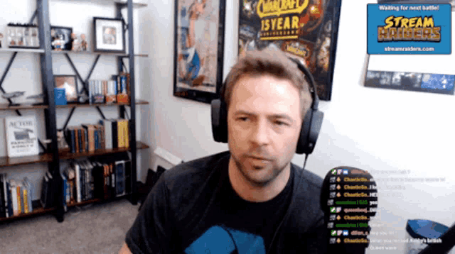 a man wearing headphones in front of a stream hader sign