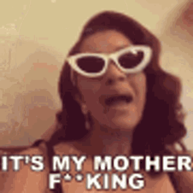 a woman wearing sunglasses is screaming and saying `` it 's my mother f ** king '' .
