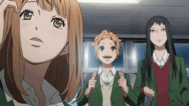 a girl with brown hair and green eyes is standing next to two other girls in school uniforms