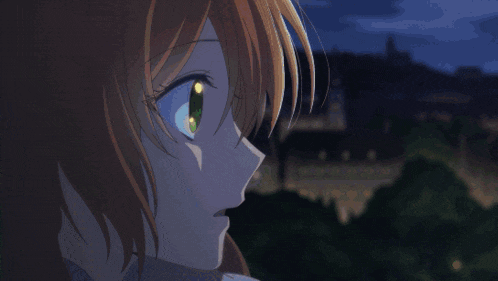 a close up of a girl 's face with a blue eye