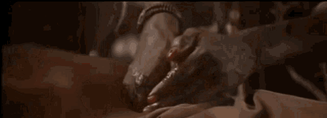 a close up of a person 's hands holding another person 's hand .