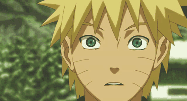 a close up of a person 's face with green eyes