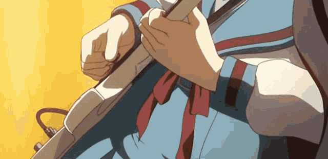 a close up of a person holding a piece of wood