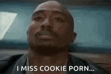 a bald man is sitting in a car and says `` i miss cookie porn ... '' .